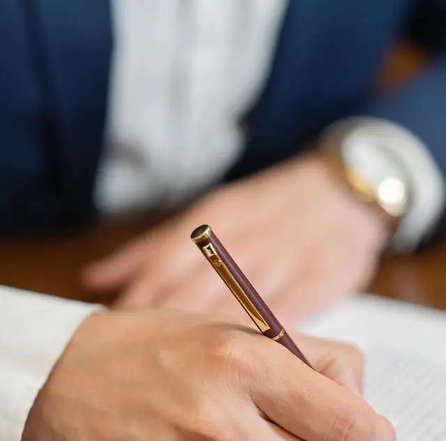 A director signing a resolution with a fountain pen