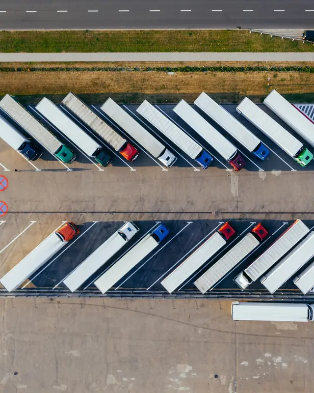 Aerial view of trailers parked in rows at a distribution centre yard