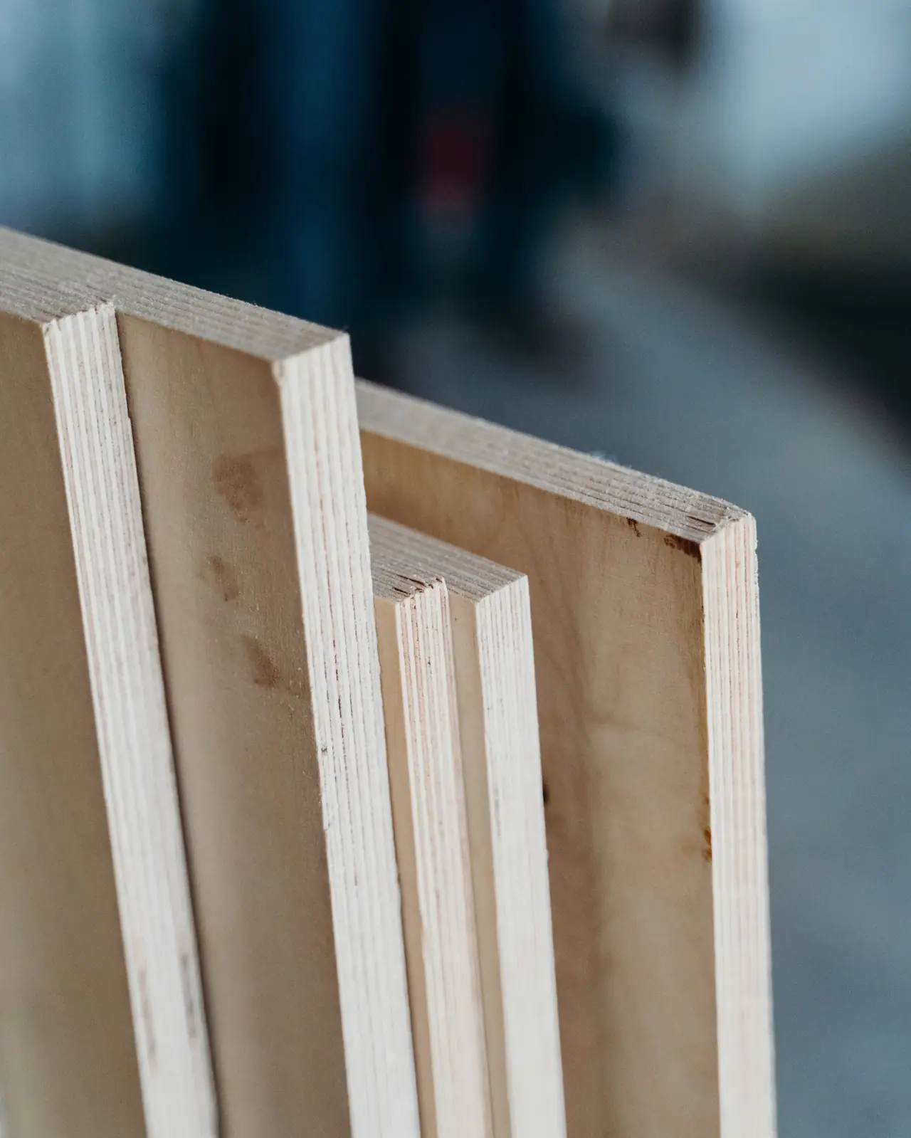 Edges of plywood sheets showing their pale cross-banded layers