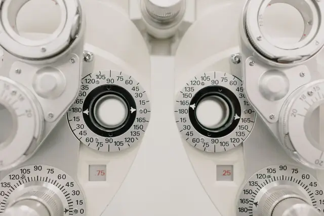 Close-up of a phoropter with its lens dials, the instrument used to measure a prescription